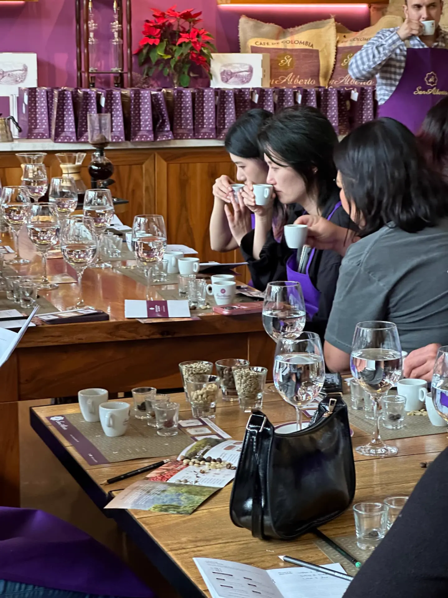 Guests cupping three coffees side by side