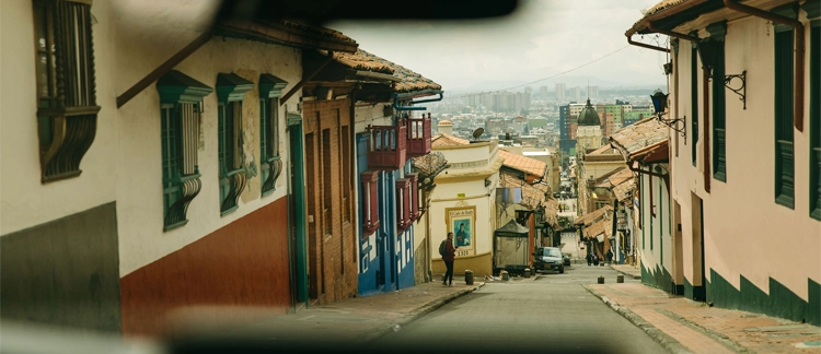 Colonial streets of La Candelaria with downtown skyline
