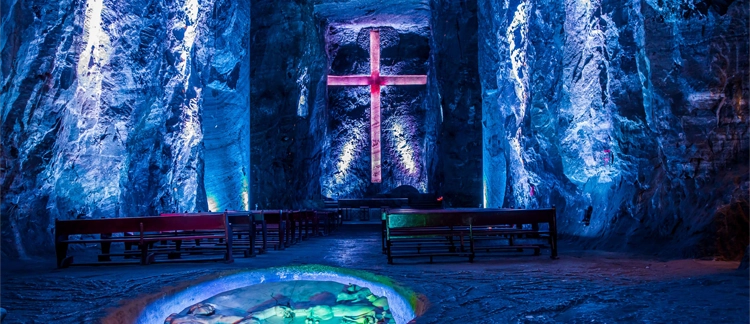 Illuminated cross in the underground sanctuary carved in salt